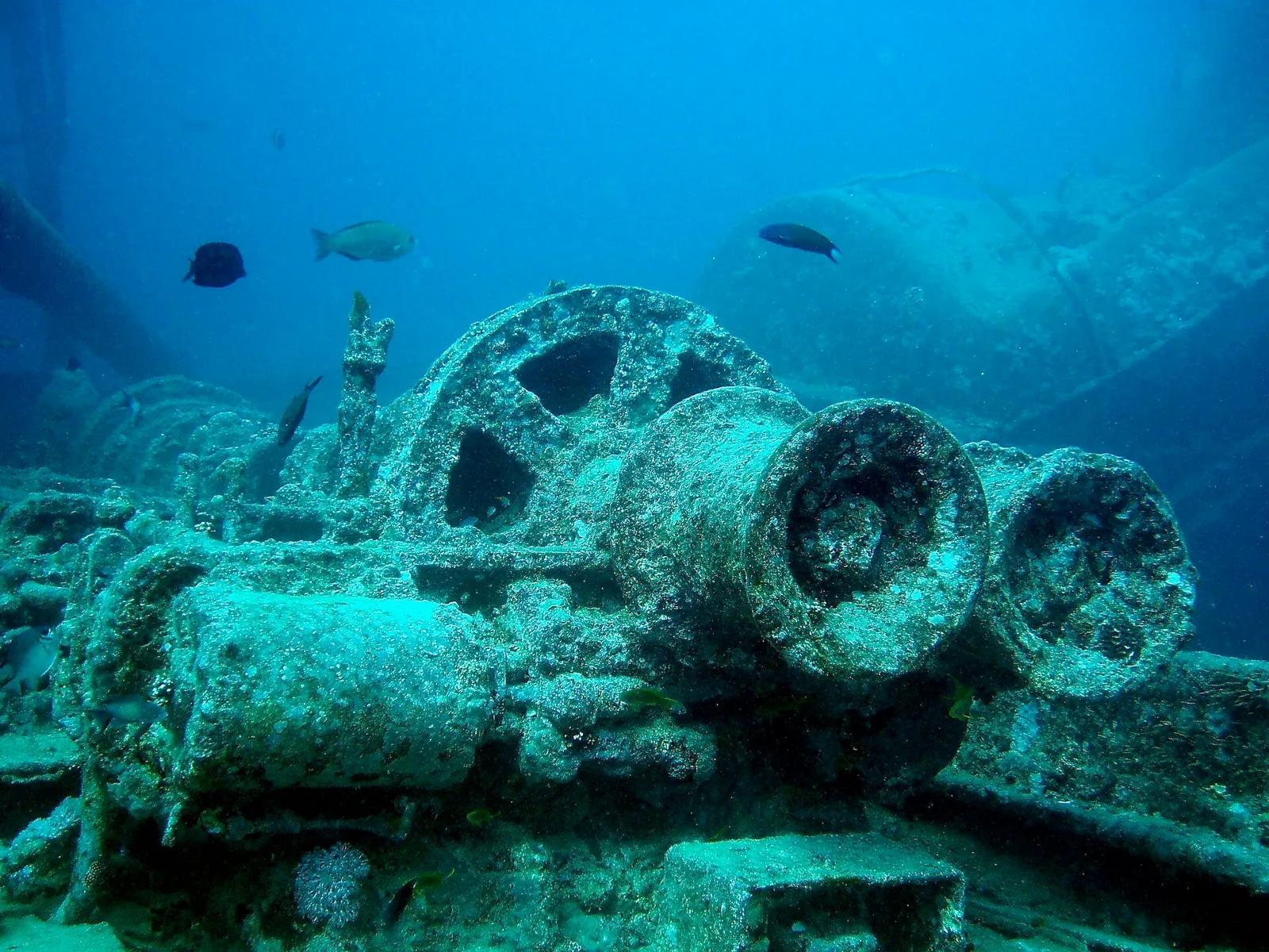 Coral-encrusted winch machinery on the deck of the SS Thistlegorm wreck, Red Sea